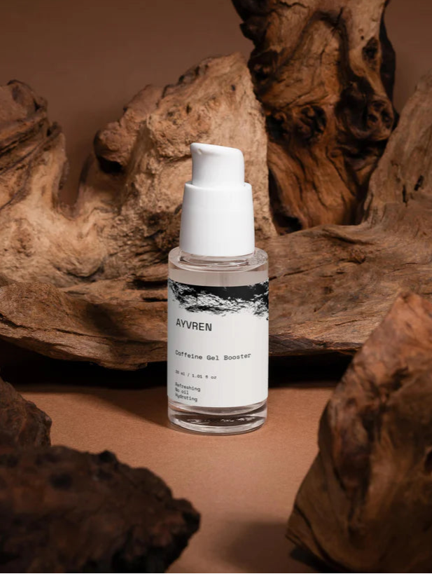 Skincare serum bottle labeled 'Aivren' on a wooden surface